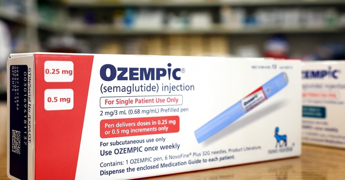 Boxes of Ozempic on a pharmacy counter.